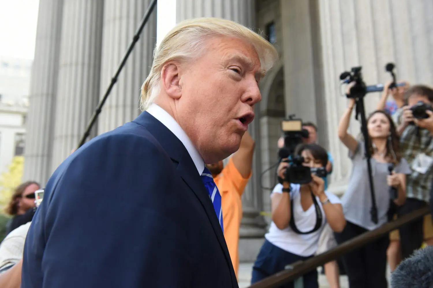Current GOP frontrunner Donald Trump criticized the automotive industry's electric vehicle transition during a weekend event in Michigan.