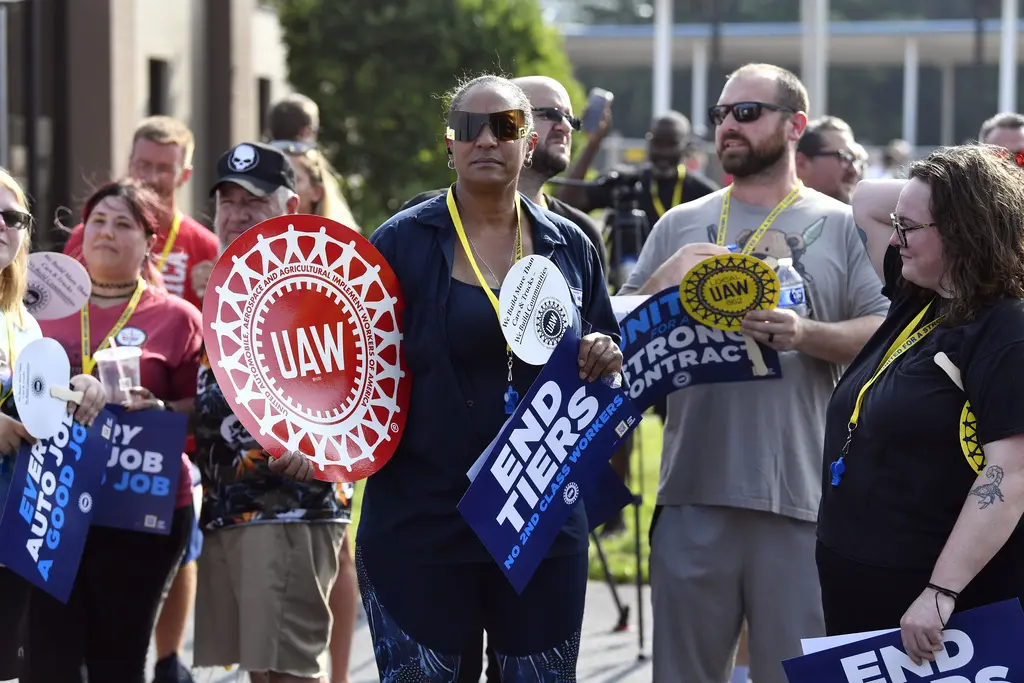 Auto News: GM's top brass highlights UAW contract challenges. Biden's EV vision gets a $12B boost, while Tesla changes pricing.
