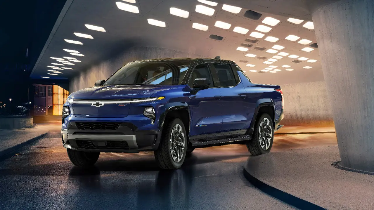 General Motors has postponed production of two new electric pickups to 2025 but denies the decision is related to the UAW strike.