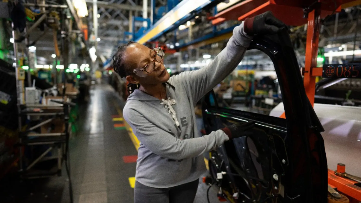 GM lays off 900 workers at Kansas plant after delaying second shift due to weaker EV demand and changes in federal incentives.