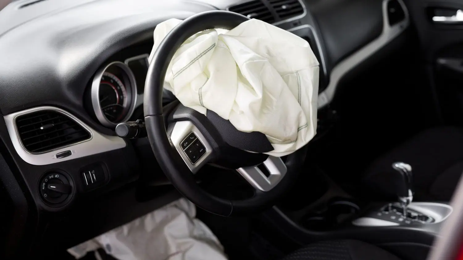 GM and U.S. regulators are probing a crash involving a recalled GMC Sierra after a Takata air bag ruptured and injured a passenger.