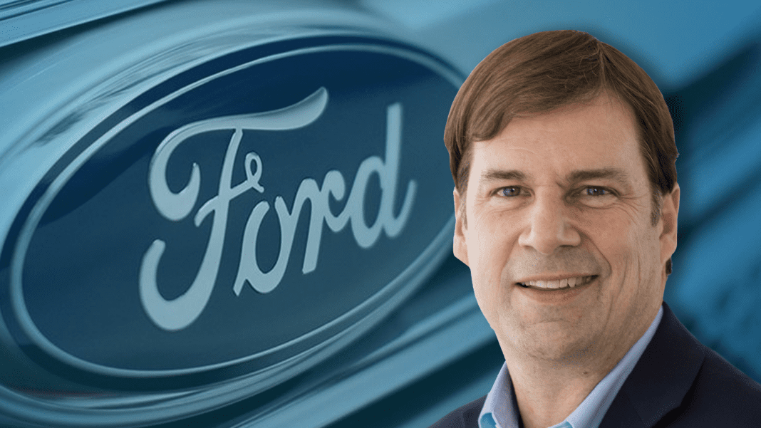 Ford CEO Jim Farley in front of Ford logo