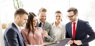 How to make your dealership’s safety training less tedious and confusing Car dealership employees review safety training materials