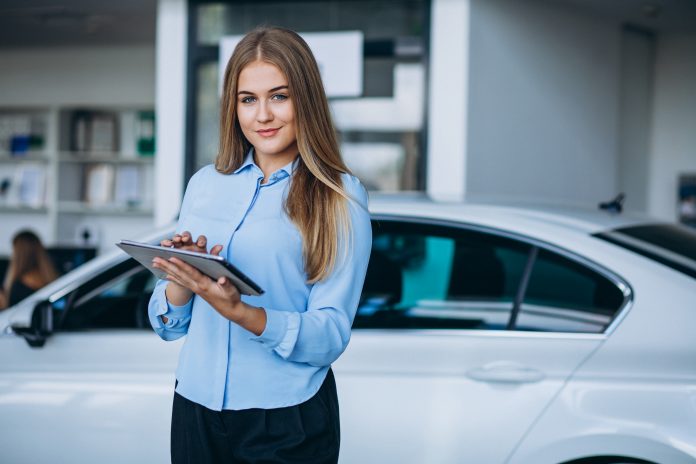 Car dealership salesperson uses digital tools to boost personalized engagement and deliver high customer value
