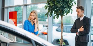 More showing, less selling leads to a better F&I experience Woman choosing a car in a car showroom during the F&I experience