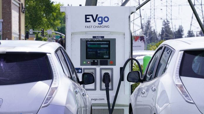 Electric cars are parked at a charging station in Sacramento, Calif., Wednesday, April 13, 2022. (AP Photo/Rich Pedroncelli)