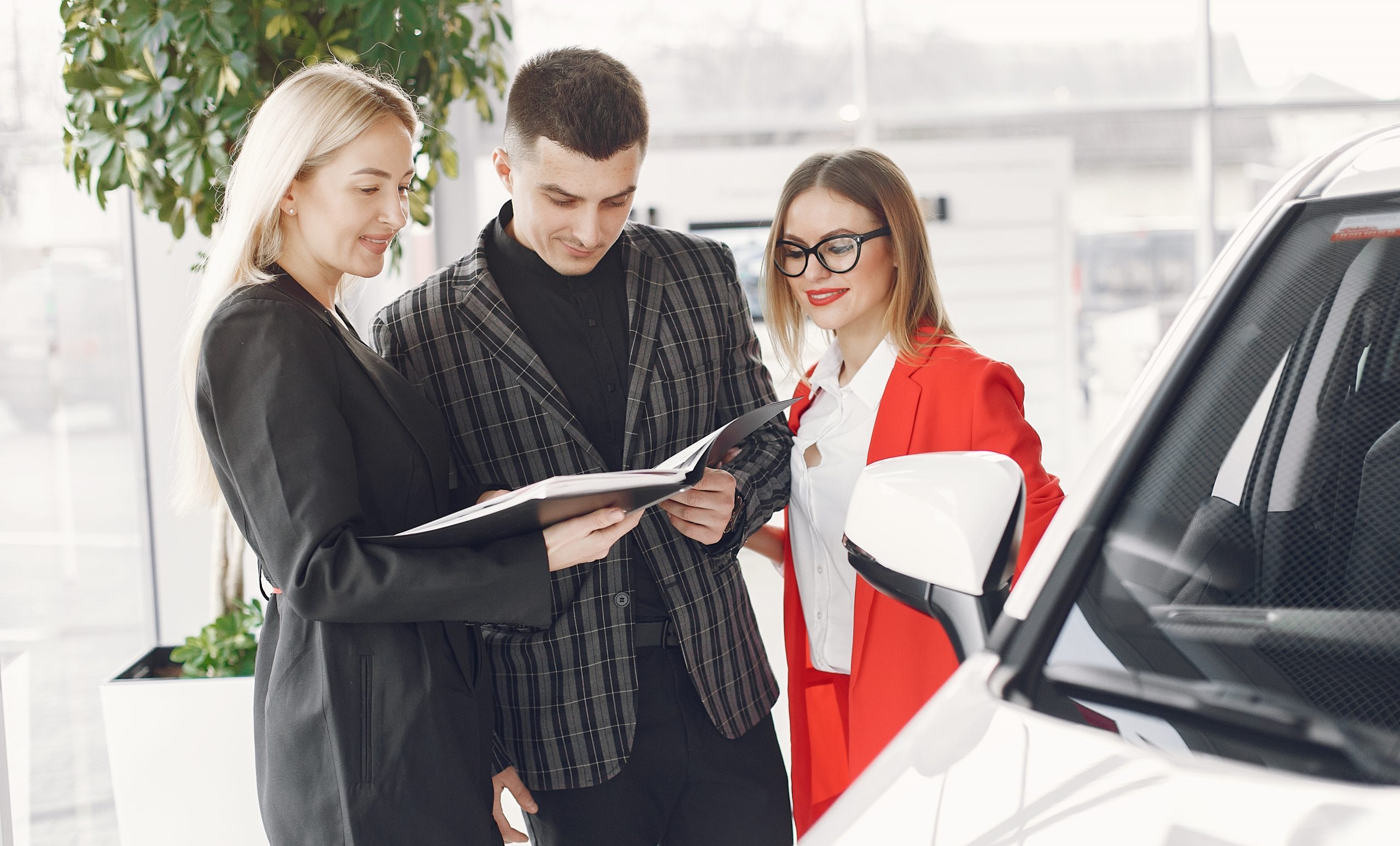 Dealership employees reviewing takeaways from their F&I meetings