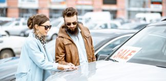 5 ways to rev up your dealership’s used car inventory for tax refund season Young couple looking at used car inventory