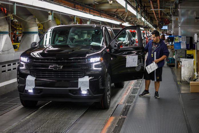 GM has halted production at two of its key assembly plants, affecting the production of its highly profitable heavy-duty pickups and SUVs