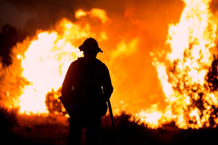 Gusts up to 70mph threaten firefighting progress in southern California as wildfires devour structures, displacing thousands of residents.