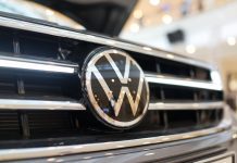Volkswagen cut its full-year outlook and reported a 29% decline in Q2 profit, as U.S. tariffs & restructuring measures impacted earnings.