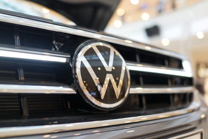 Volkswagen cut its full-year outlook and reported a 29% decline in Q2 profit, as U.S. tariffs & restructuring measures impacted earnings.
