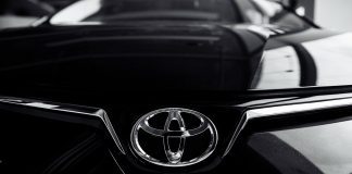 Toyota lowers profit forecast amid U.S. auto tariffs Toyota reported a drop in operating profit for the June quarter, driven largely by U.S. tariffs on imported vehicles and currency fluctuations
